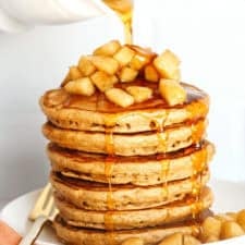 Light and fluffy Healthy Apple Cinnamon Pancakes made with whole wheat flour, applesauce in place of oil and zero butter or refined sugar! Topped with warm spiced apples and drizzled with maple syrup!