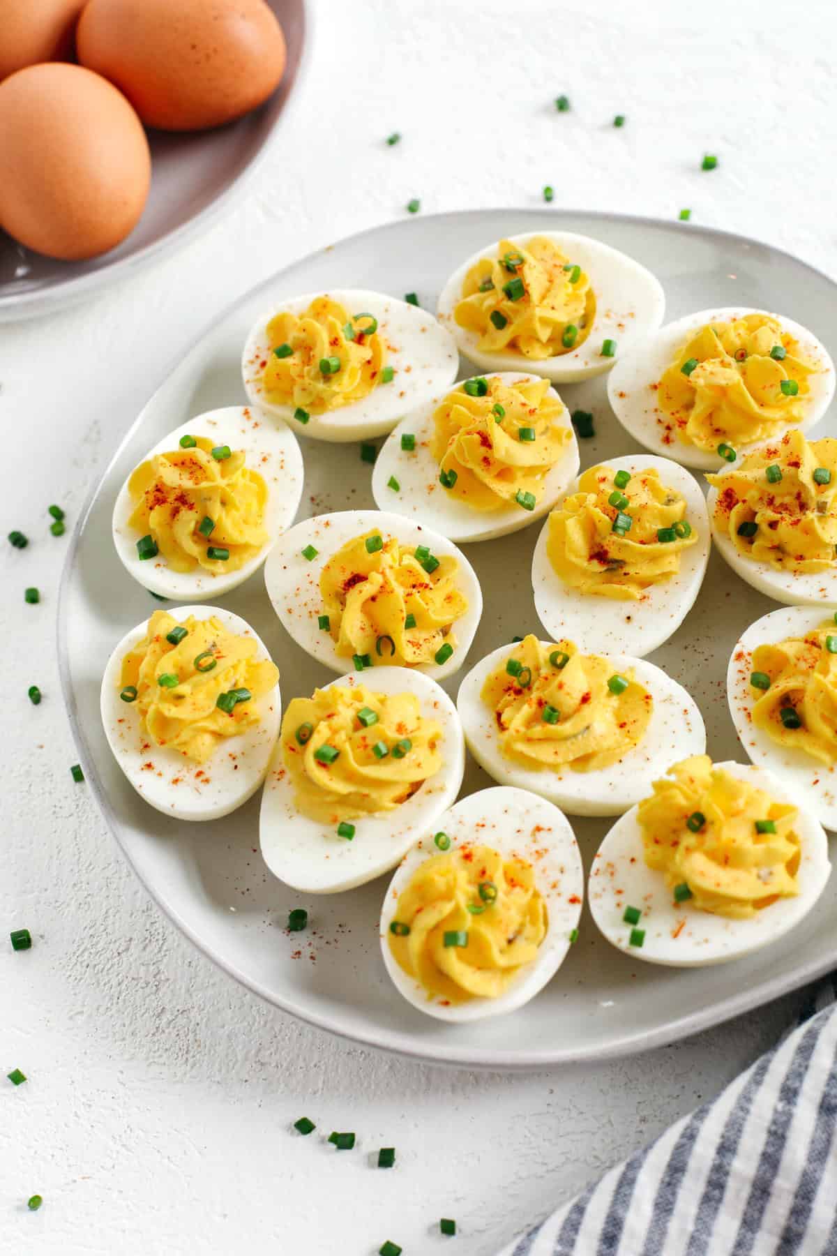 These Healthier Deviled Eggs are a classic recipe that are much lighter in calories thanks to using Greek yogurt! Perfect for parties, Sunday brunch or even a delicious afternoon snack!