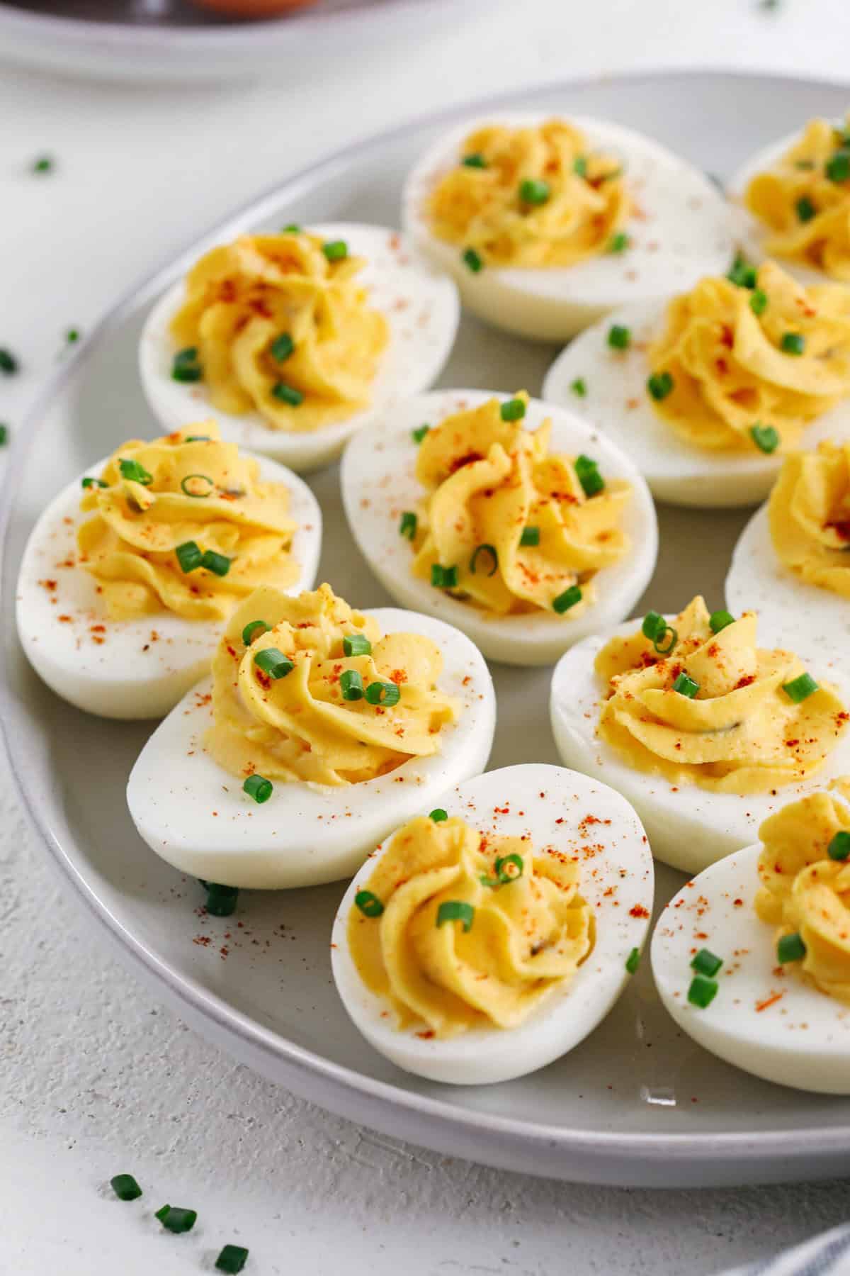 These Healthier Deviled Eggs are a classic recipe that are much lighter in calories thanks to using Greek yogurt! Perfect for parties, Sunday brunch or even a delicious afternoon snack!