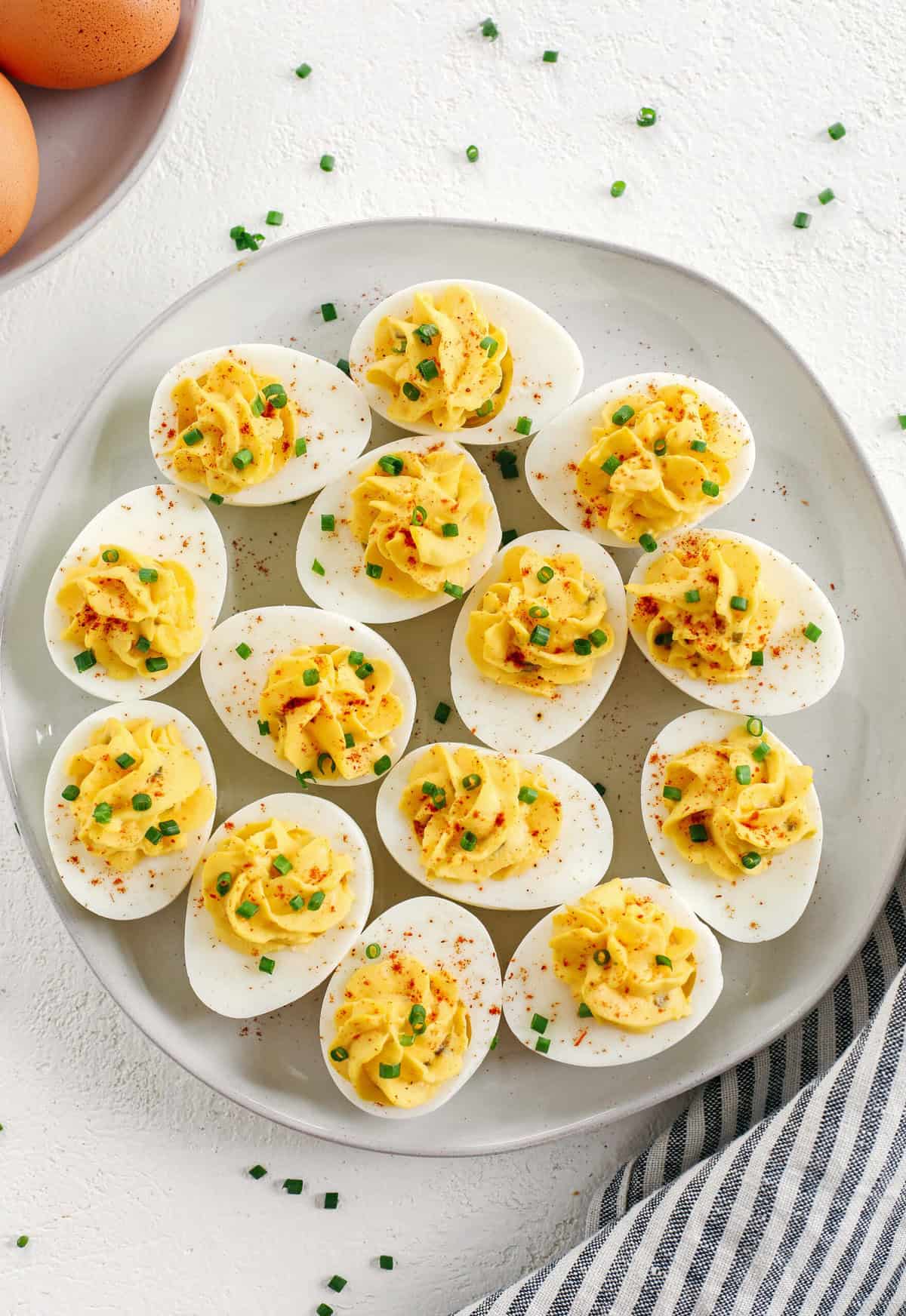 These Healthier Deviled Eggs are a classic recipe that are much lighter in calories thanks to using Greek yogurt! Perfect for parties, Sunday brunch or even a delicious afternoon snack!