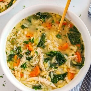 Easy and delicious Lemon Chicken Orzo Soup loaded with tender chicken, fresh veggies, and leafy greens all simmered in the most flavorful broth! Easily made in one pot for a cozy weeknight dinner the whole family will love!