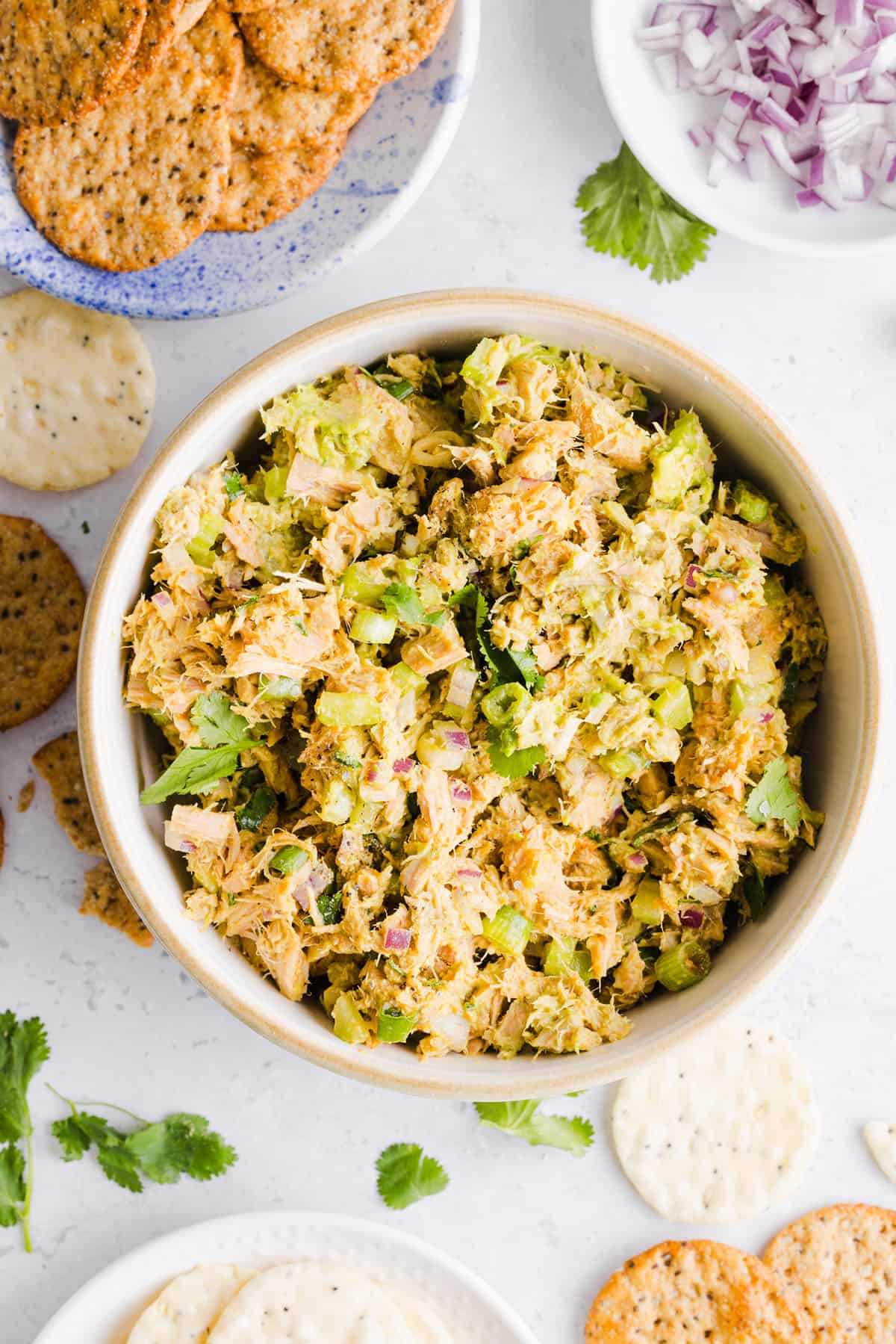 The BEST Spicy Tuna Avocado Wrap made with canned tuna, sriracha, crisp veggies and avocado that easily comes together in just 5 minutes! Delicious high-protein snack with crackers or served in a wrap for a healthy lunch.