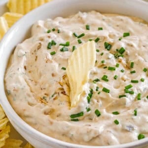Delicious High Protein French Onion Dip made healthier with protein-packed cottage cheese, caramelized onions, and fresh herbs for the perfect dip to serve with chips, veggies and crackers!