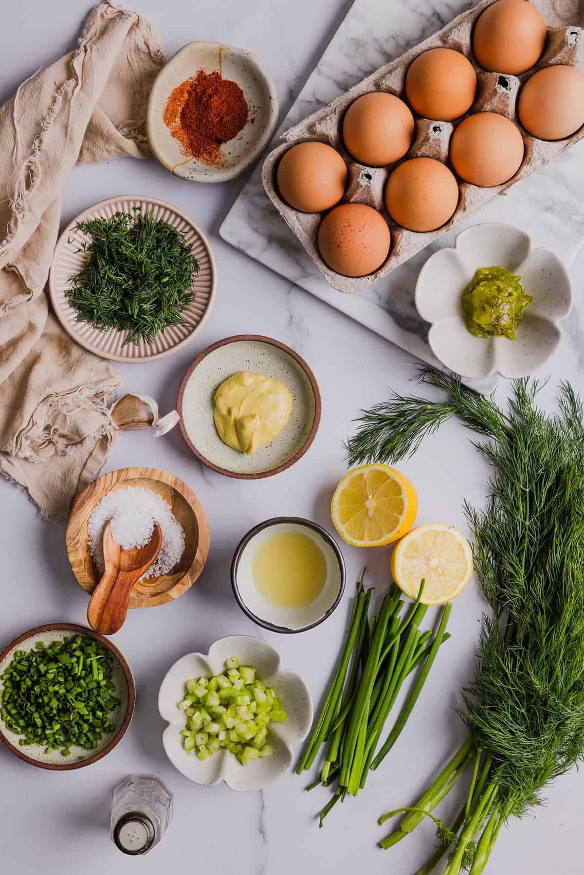 This Healthy Egg Salad is packed with protein, fresh flavors and made healthier with Greek yogurt in place of mayo! Enjoy this on a sandwich, lettuce wrap, with crackers or straight from the bowl!
