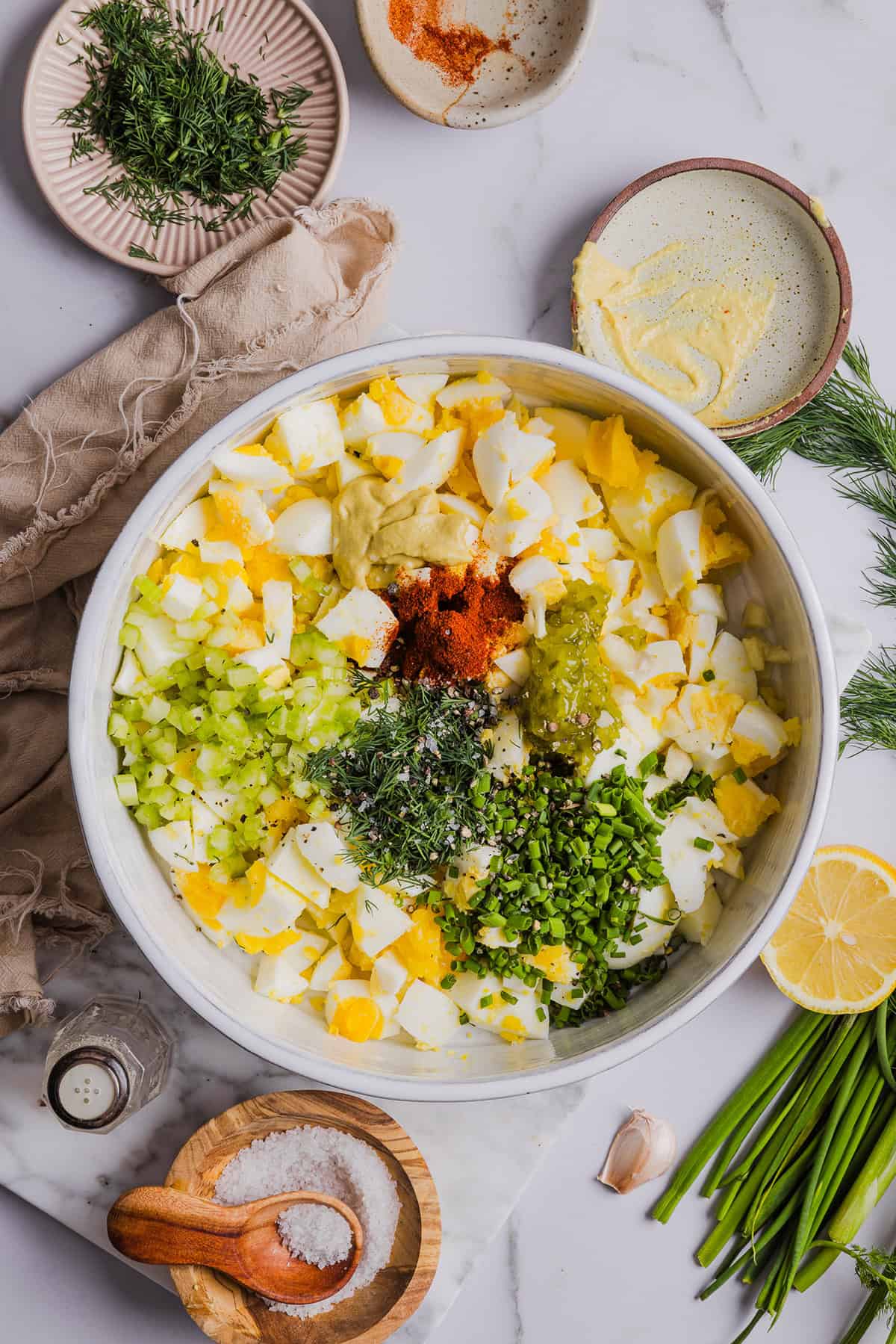 This Healthy Egg Salad is packed with protein, fresh flavors and made healthier with Greek yogurt in place of mayo! Enjoy this on a sandwich, lettuce wrap, with crackers or straight from the bowl!