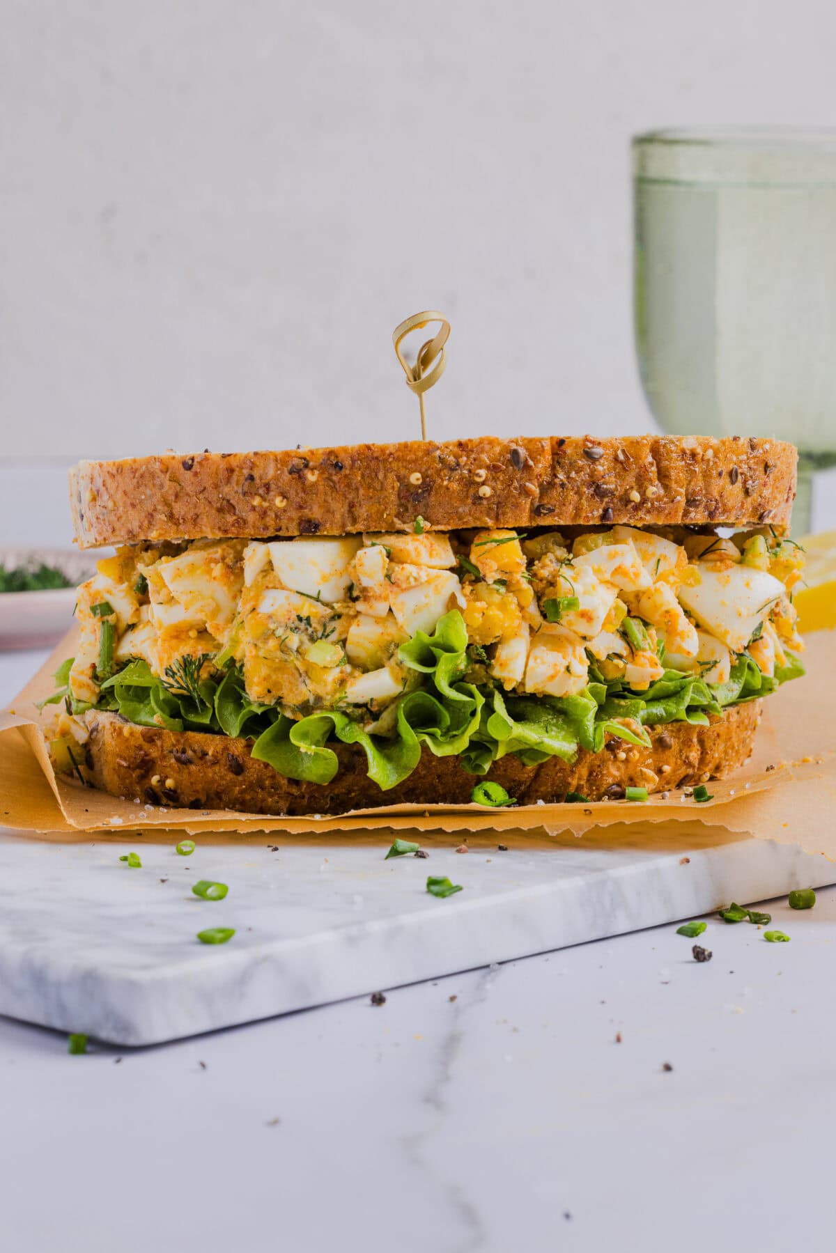 This Healthy Egg Salad is packed with protein, fresh flavors and made healthier with Greek yogurt in place of mayo! Enjoy this on a sandwich, lettuce wrap, with crackers or straight from the bowl!